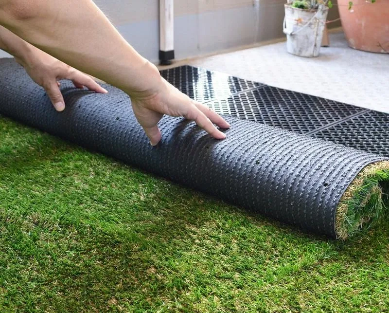 Drainage mat under artificial grass