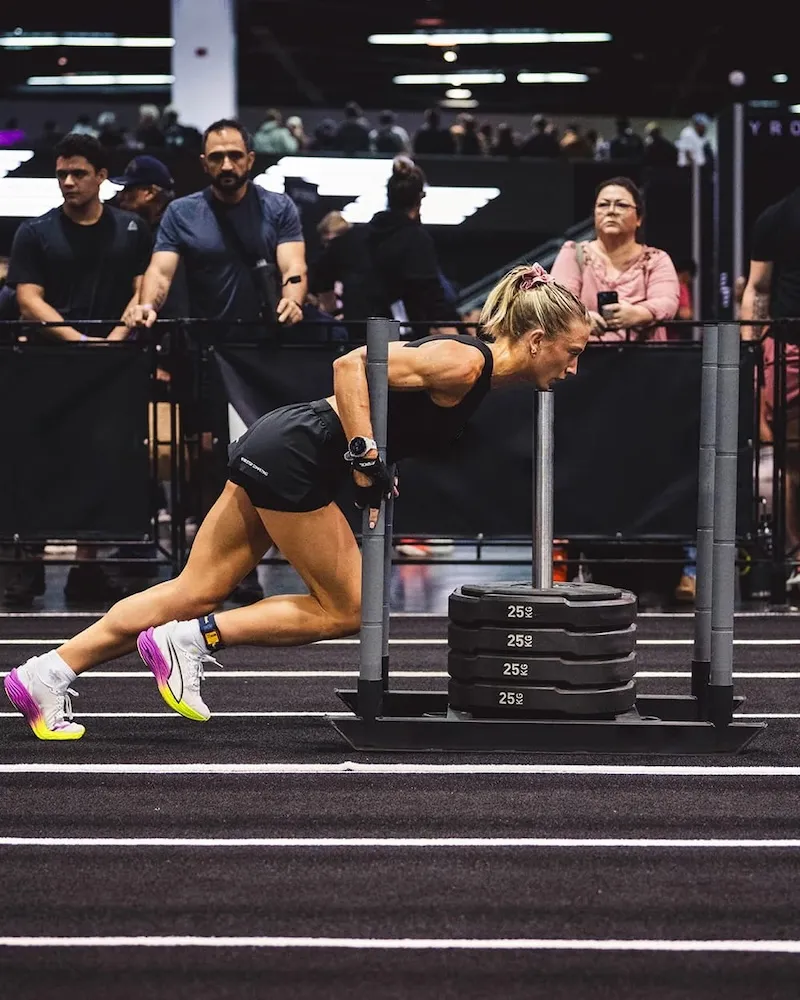 Temporary visual placeholder showing a weighted sled on turf during an internal gym-use check.
