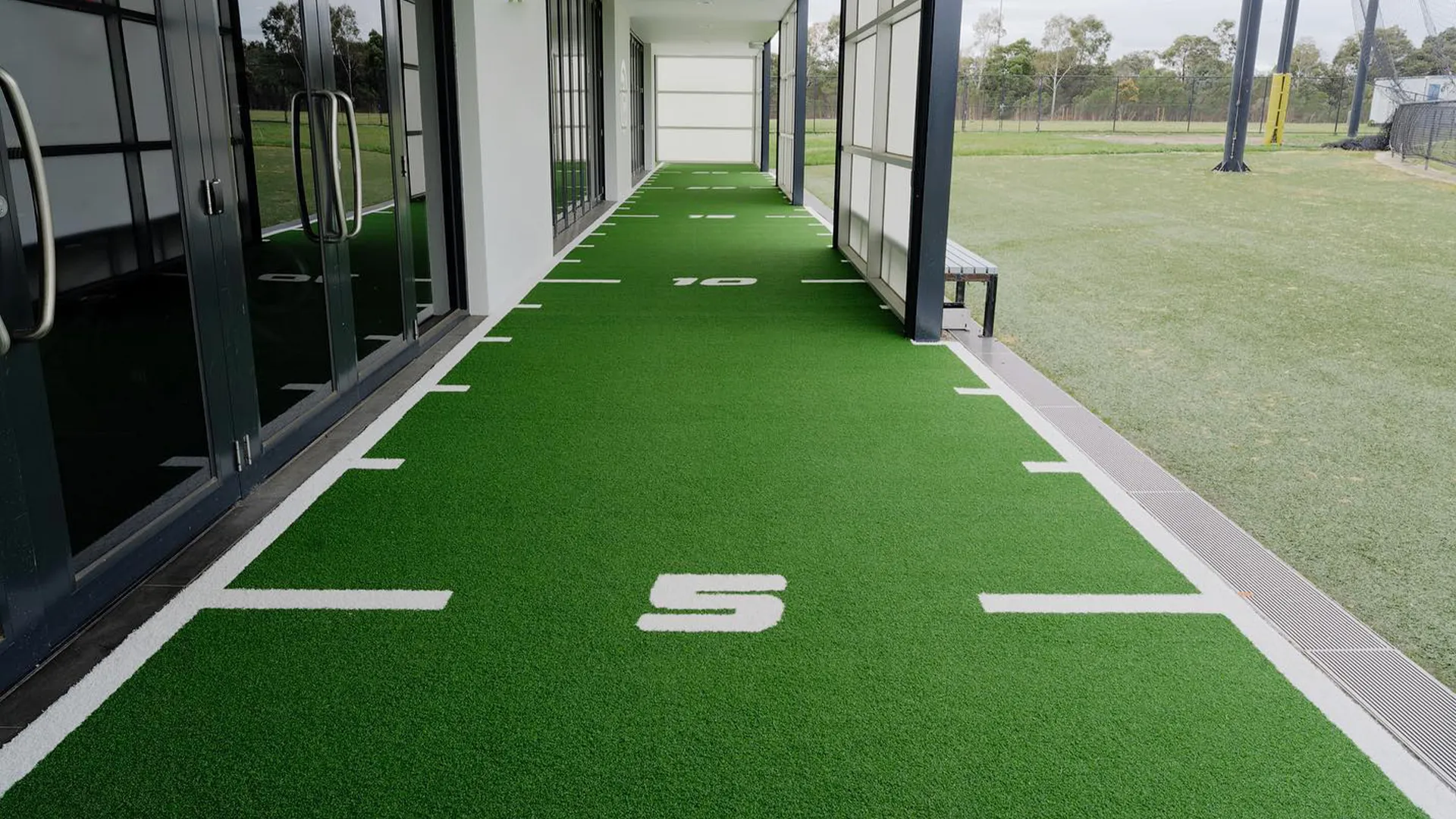 Commercial gym turf sled track
